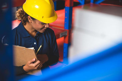Woman in a warehouse preparing to pack and ship orders representing Curative's Fulfillment Services