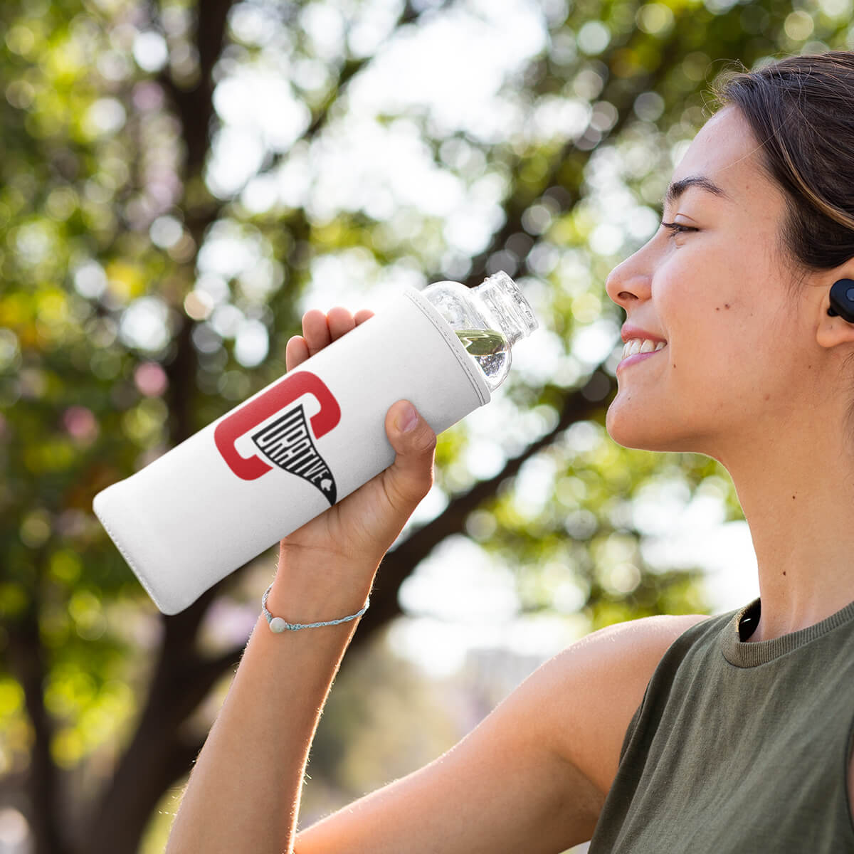 Woman drinking from white can cooler custom promotional drinkware by curative printing