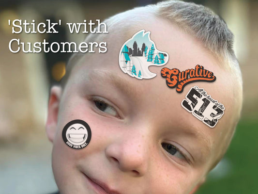 Boys face covered in Curative Printing custom stickers.