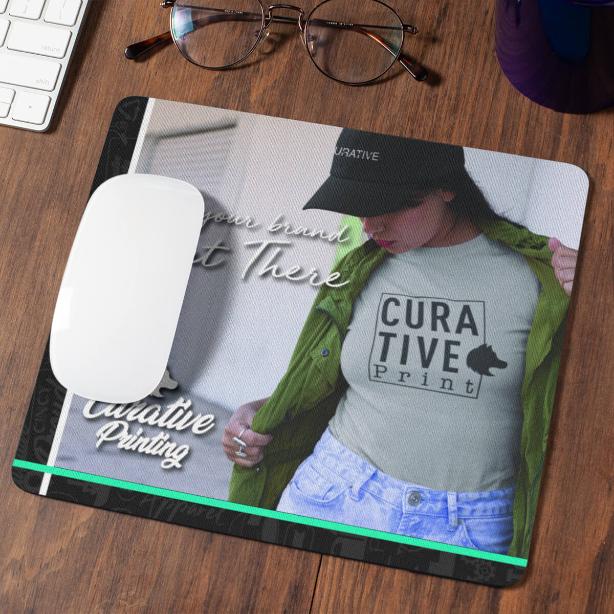 Computer desk with glasses and photo branded mouse pad promotional technology by curative printing