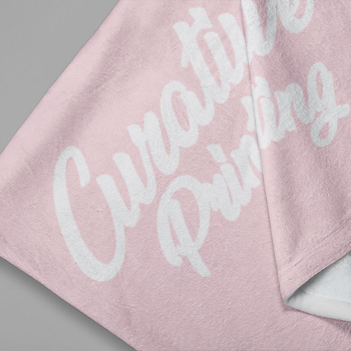 Soft pink with white imprint custom promotional fleece blankets by curative printing
