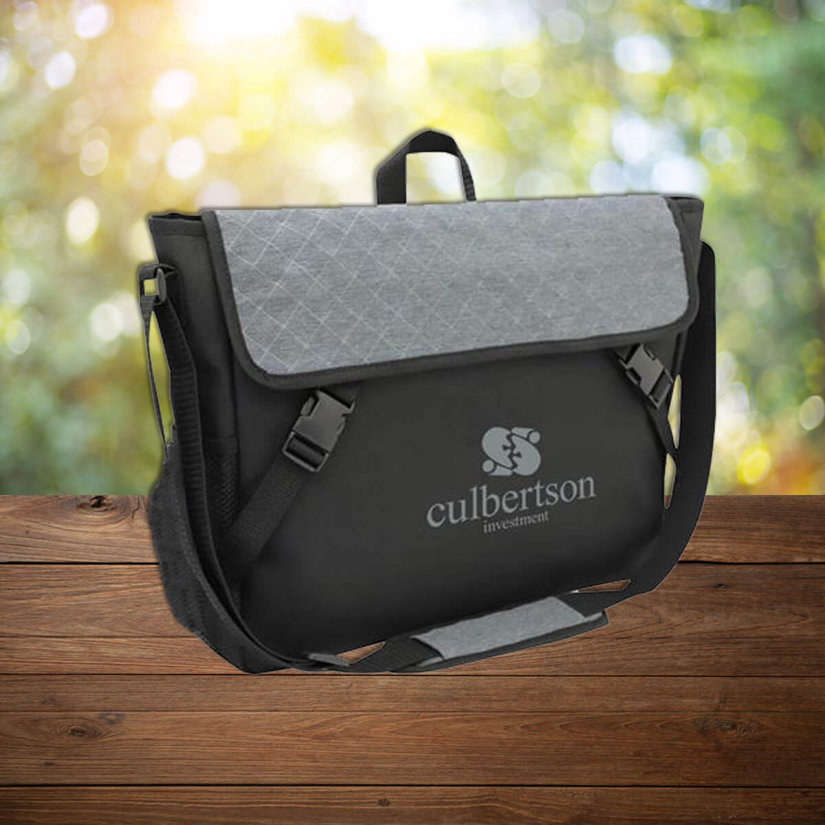 Black and grey quilted custom promotional messenger bags by curative printing