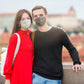 Sightseeing couple wearing company branded face masks promotional wellness & safety by curative printing