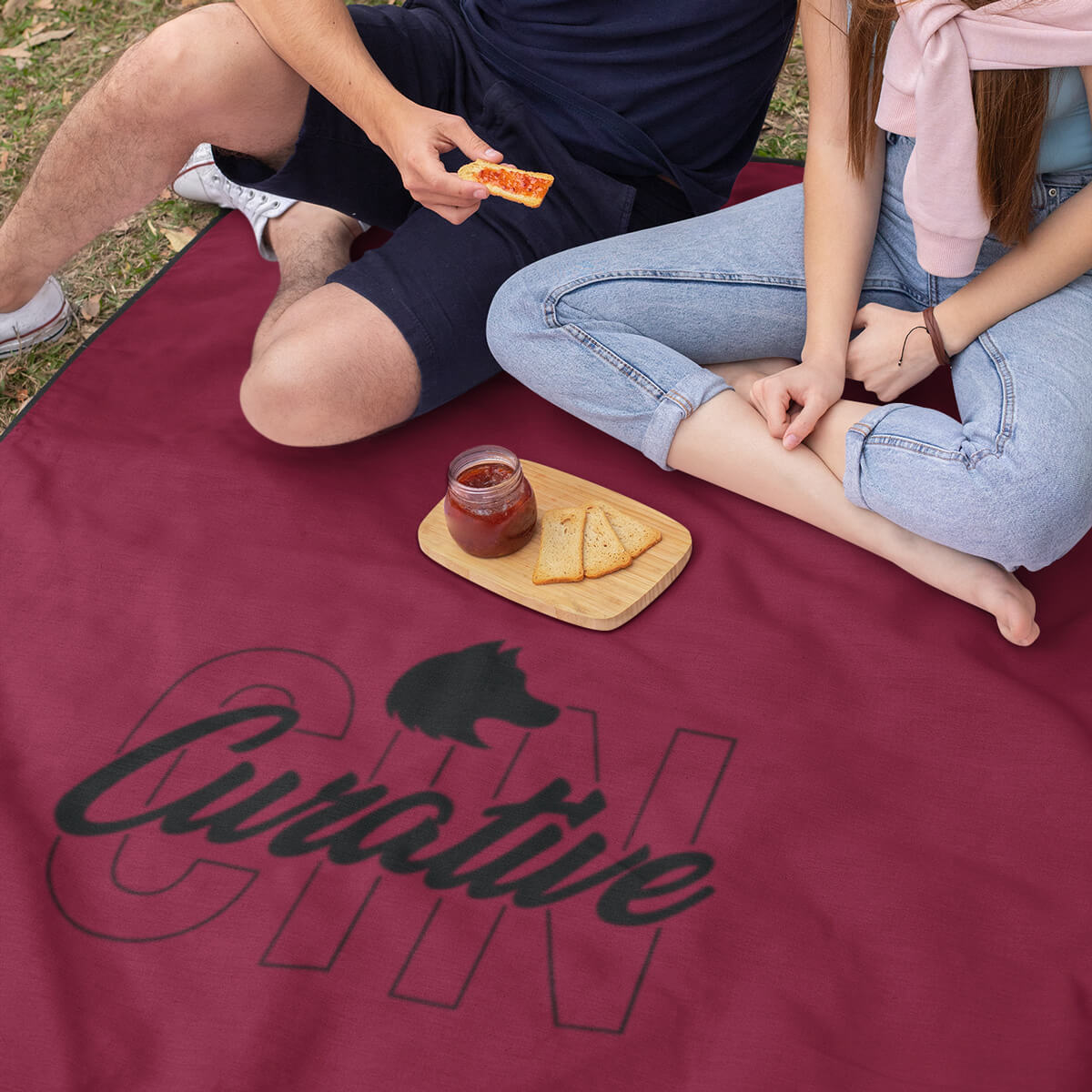 Picnic on a red with black imprint custom promotional roll-up blankets by curative printing