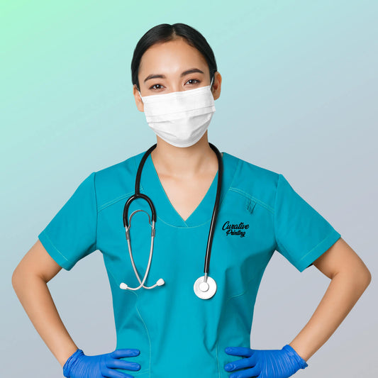 Female doctor posing in custom branded scrub apparel promotional wellness & safety by curative printing