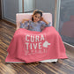 Girl covered by pink with white imprint custom promotional fleece blankets by curative printing