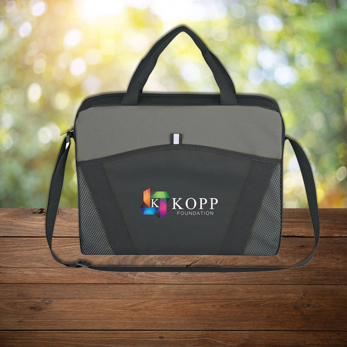 Black and grey custom promotional messenger bags by curative printing