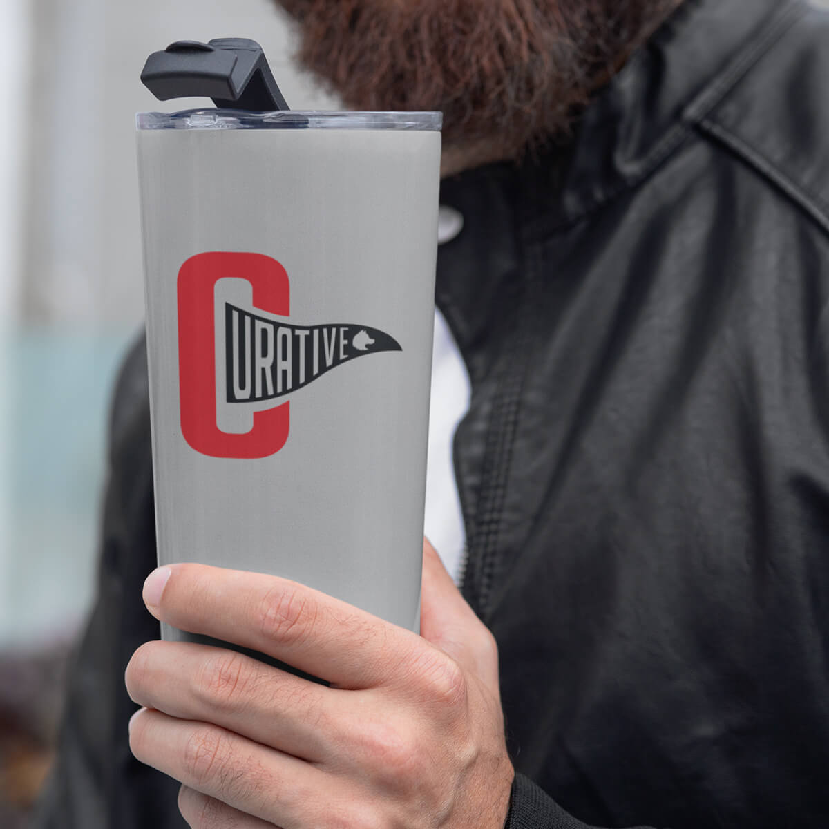 Bearded man holding sporty travel mug tumbler custom promotional drinkware by curative printing