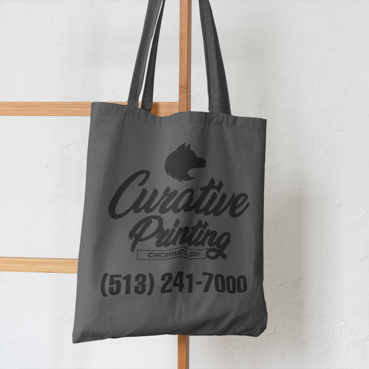 Grey with black imprint custom promotional tote bags by curative printing