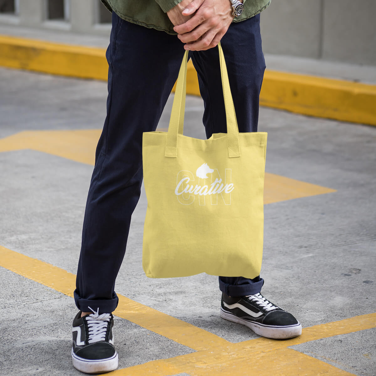Yellow with white imprint custom promotional tote bags by curative printing