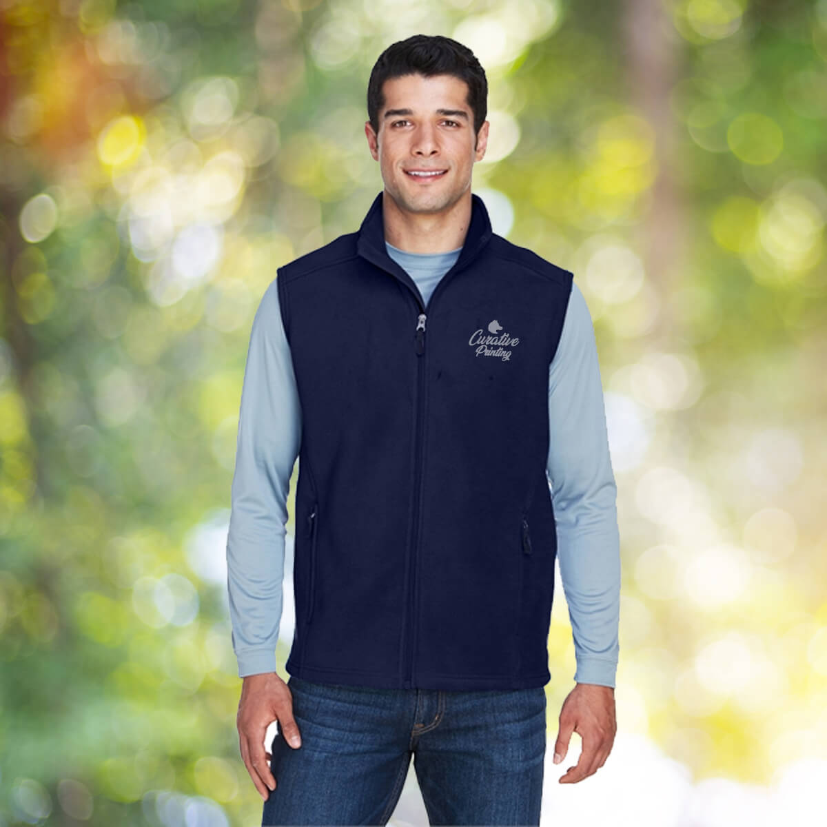 Man outdoors wearing navy vest outerwear apparel with white curative printing logo imprint