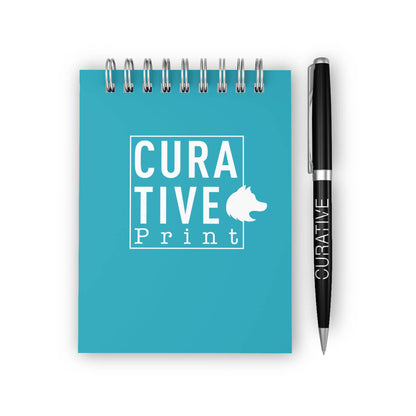 Turquoise notebook and black metal pen with branding promotional writing implements by curative printing