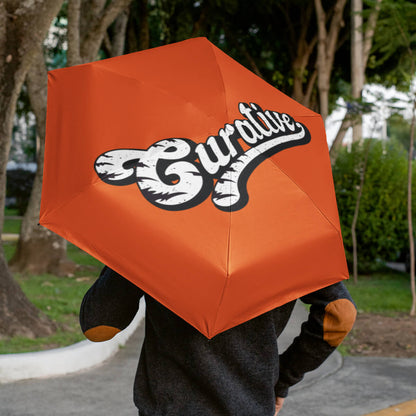 Man walking away holding orange folding umbrella promotional umbrellas by curative printing