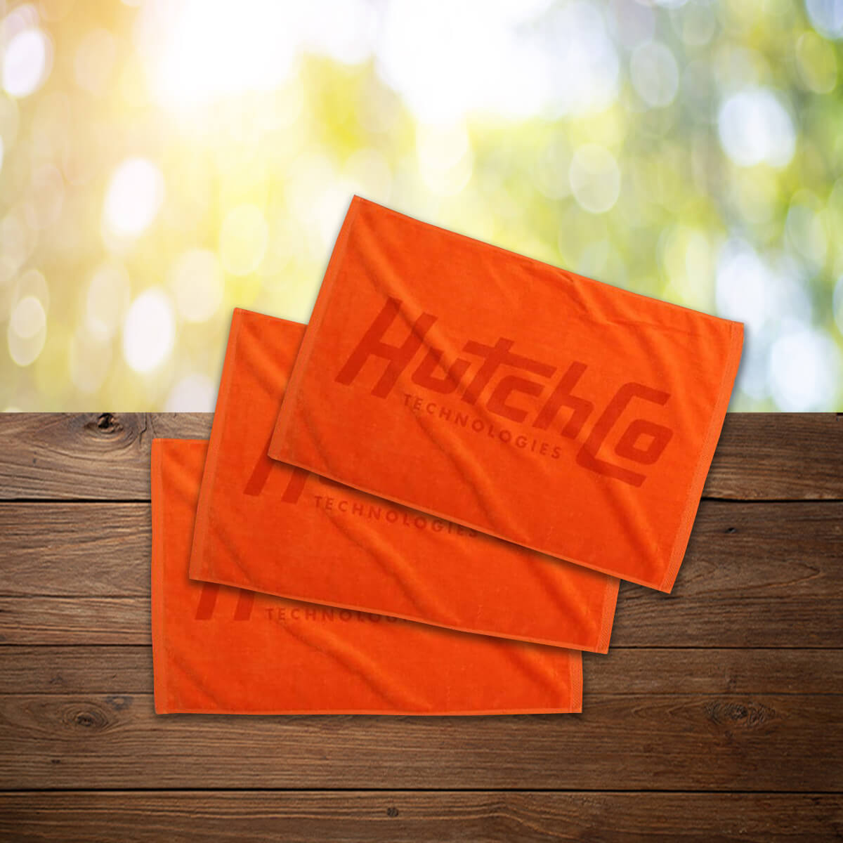 Orange logo imprint sports towel promotional towels by curative printing