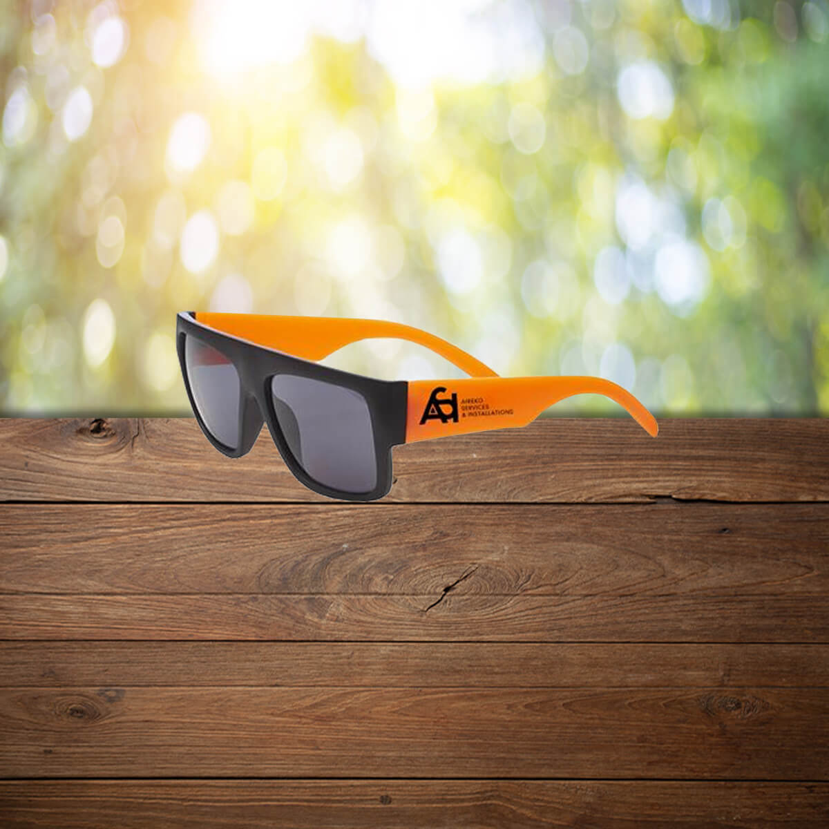 Orange thick arm black branded sunglasses promotional wellness & safety by curative printing