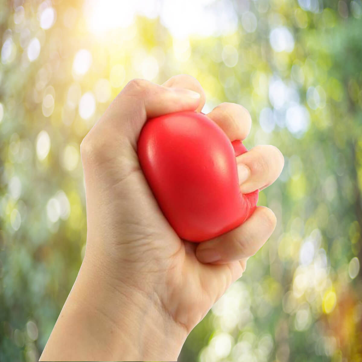 Hand squeezing red stress ball promotional wellness & safety by curative printing