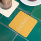 Tile table top with orange square coaster custom promotional drinkware by curative printing