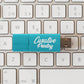 Keyboard under a turquoise USB flash drive promotional technology by curative printing