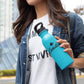 Woman holding aluminum turquoise sports bottle custom promotional drinkware by curative printing