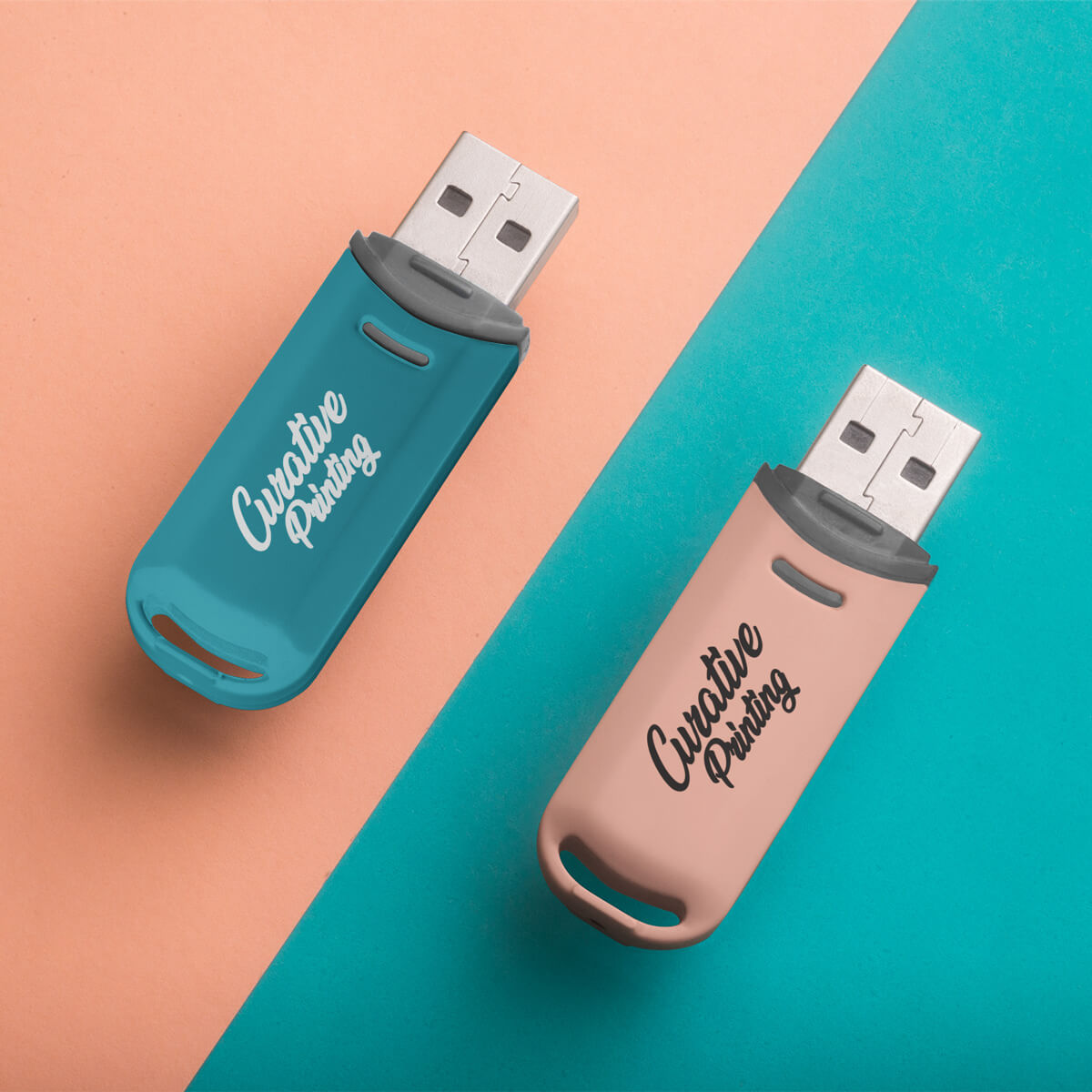 Turquoise and pink background with pink and turquoise USB flash drives promotional technology by curative printing