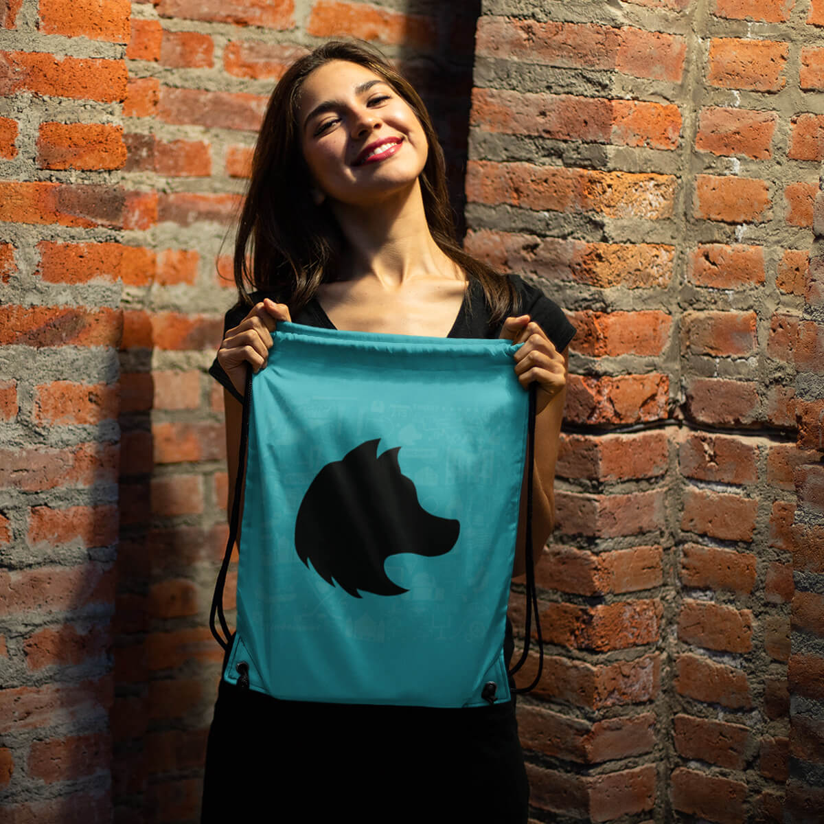 Woman holding turquoise custom promotional drawstring bags by curative printing