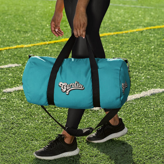 Sporty woman holding turquoise custom promotional duffle bags by curative printing