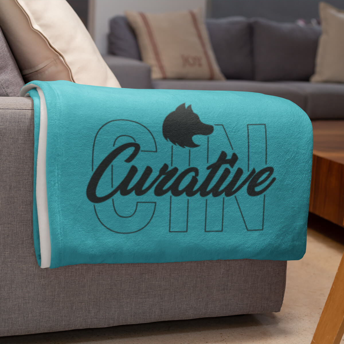 Turquoise with black imprint custom promotional fleece blankets by curative printing