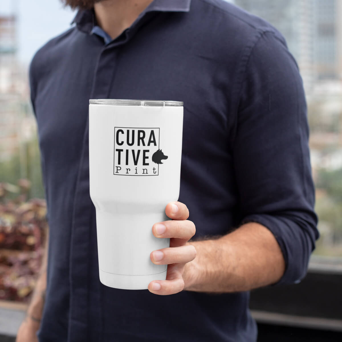 On-the-go man holding white travel mug tumbler custom promotional drinkware by curative printing