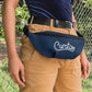 Woman wearing navy custom promotional fanny pack bags by curative printing